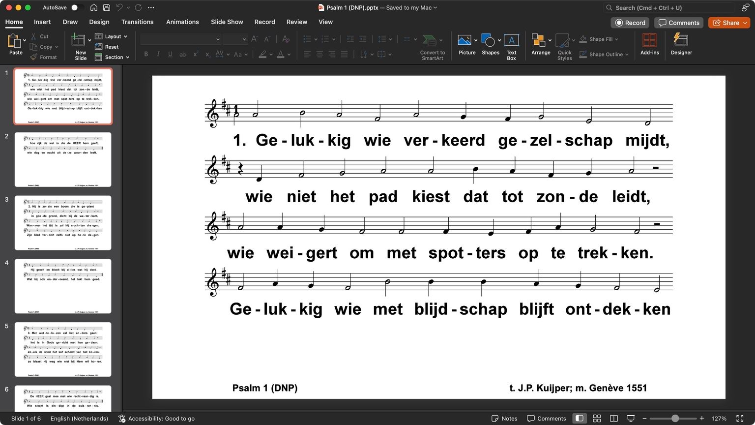 Desktop with a PowerPoint window opened showing multiple white slides with text with musical notation